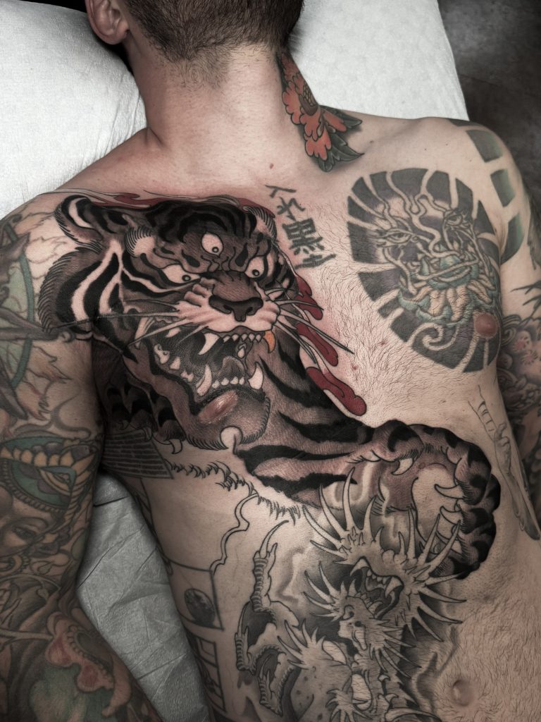 Japanese Style Three Eyed Tiger Chest Tattoo